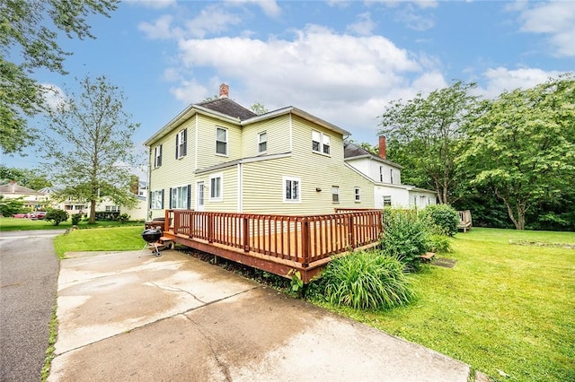 407 Hill St, Grove City Boro, PA 16127 - rear view of property with a chimney, a yard, and a deck
