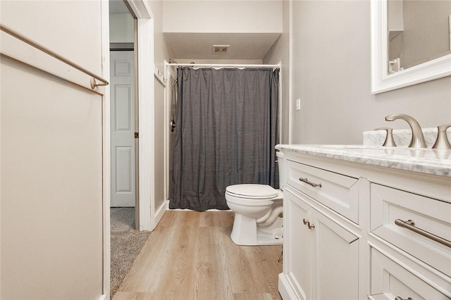 407 Hill St, Grove City Boro, PA 16127 - bathroom with vanity, wood finished floors, and a shower with shower curtain