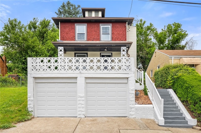404 Ariston Ave, Carrick, PA 15210 - traditional style home featuring stairway, an attached garage, concrete driveway, and covered porch