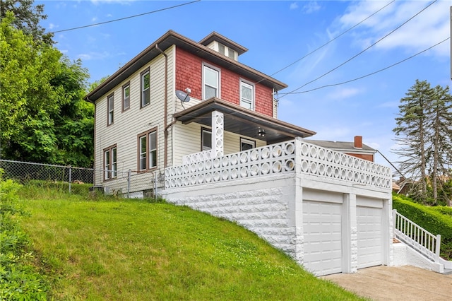 404 Ariston Ave, Carrick, PA 15210 - traditional style home featuring a garage, concrete driveway, and covered porch
