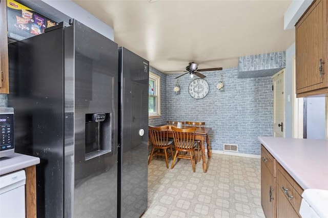 623 Rte 30, Findlay Twp, PA 15126 - kitchen with a ceiling fan, light floors, stainless steel appliances, brown cabinets, and light countertops