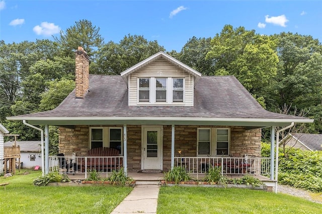 623 Rte 30, Findlay Twp, PA 15126 - view of front of property featuring a porch, stone siding, a front yard, and a chimney