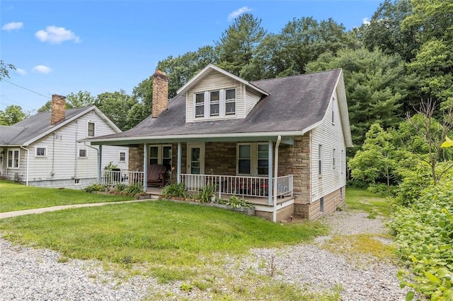 623 Rte 30, Findlay Twp, PA 15126 - bungalow-style house with stone siding, a porch, a front lawn, and a chimney