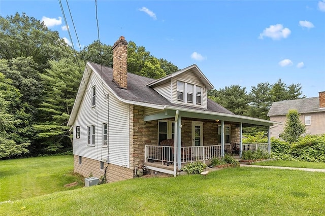 623 Rte 30, Findlay Twp, PA 15126 - bungalow-style house with a porch, stone siding, a front lawn, and a chimney