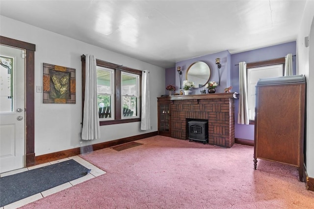 623 Rte 30, Findlay Twp, PA 15126 - carpeted living area featuring a wood stove and baseboards