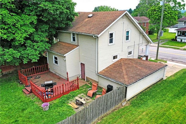 1107 W Ridge Ave, Sharpsville, PA 16150 - rear view of house featuring a shingled roof and a deck