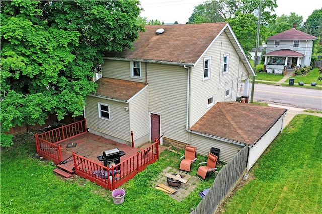 1107 W Ridge Ave, Sharpsville, PA 16150 - rear view of property featuring a deck, a shingled roof, and a fire pit