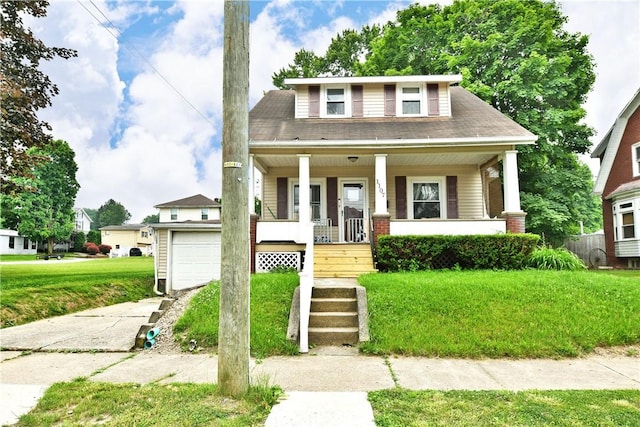 1107 W Ridge Ave, Sharpsville, PA 16150 - bungalow-style house featuring a porch, a front lawn, and asphalt driveway