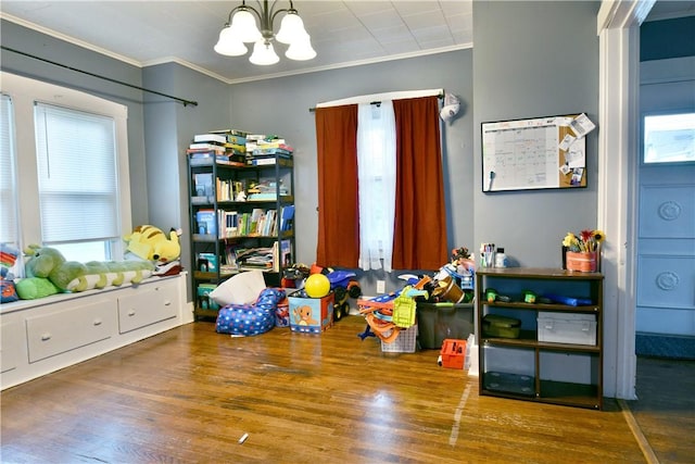 1107 W Ridge Ave, Sharpsville, PA 16150 - playroom featuring ornamental molding, a chandelier, and wood finished floors