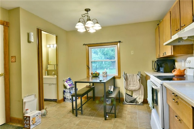 1107 W Ridge Ave, Sharpsville, PA 16150 - kitchen with white range with electric cooktop, black microwave, under cabinet range hood, light countertops, and a chandelier
