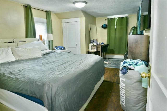 1107 W Ridge Ave, Sharpsville, PA 16150 - bedroom with dark wood finished floors and a textured ceiling