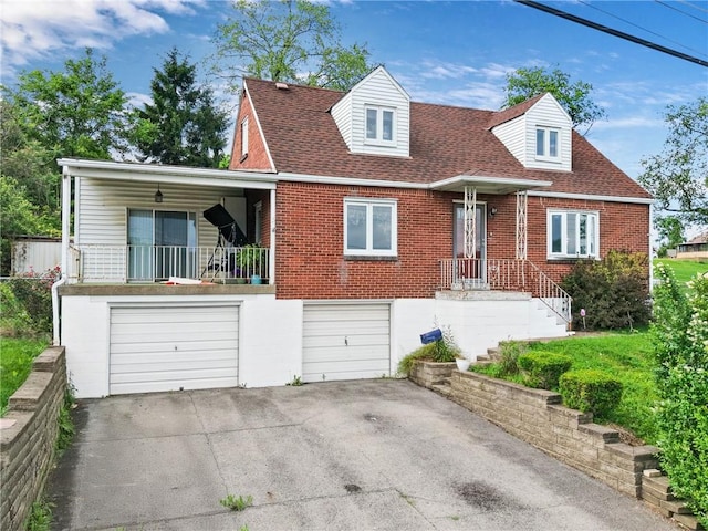 615 School St, West Mifflin, PA 15122 - new england style home featuring concrete driveway, a garage, brick siding, and roof with shingles