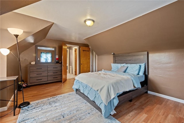 615 School St, West Mifflin, PA 15122 - bedroom with light wood finished floors and vaulted ceiling