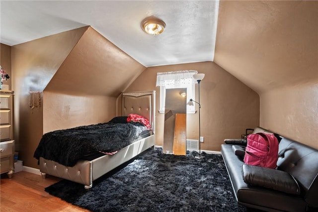 615 School St, West Mifflin, PA 15122 - bedroom with lofted ceiling and wood finished floors