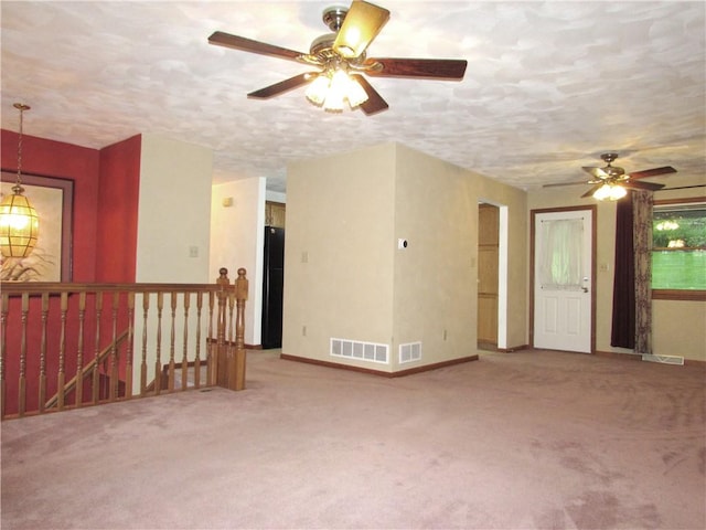 3853 Grist Mill Ln, Murrysville, PA 15668 - carpeted spare room with a ceiling fan and a textured ceiling