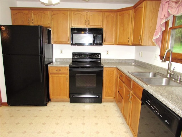3853 Grist Mill Ln, Murrysville, PA 15668 - kitchen with black appliances, light floors, light countertops, and brown cabinets