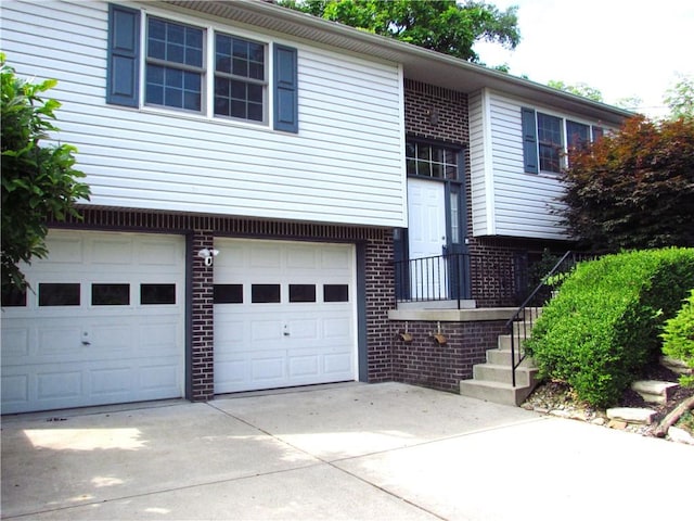 3853 Grist Mill Ln, Murrysville, PA 15668 - bi-level home with brick siding, concrete driveway, and an attached garage