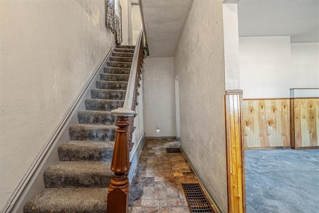 101 7th St, Monongahela City, PA 15063 - staircase featuring a textured wall and stone finish flooring