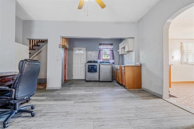 101 7th St, Monongahela City, PA 15063 - office space with washing machine and clothes dryer, arched walkways, light wood-type flooring, and ceiling fan