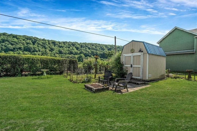 101 7th St, Monongahela City, PA 15063 - view of grassy yard with a storage unit and a forest view