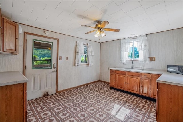 101 7th St, Monongahela City, PA 15063 - kitchen with black microwave, ceiling fan, light countertops, and brown cabinets