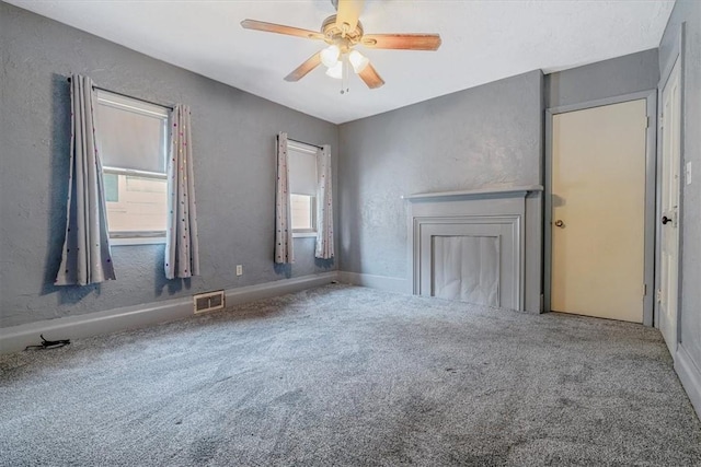 101 7th St, Monongahela City, PA 15063 - unfurnished living room with healthy amount of natural light, carpet, ceiling fan, and a textured wall