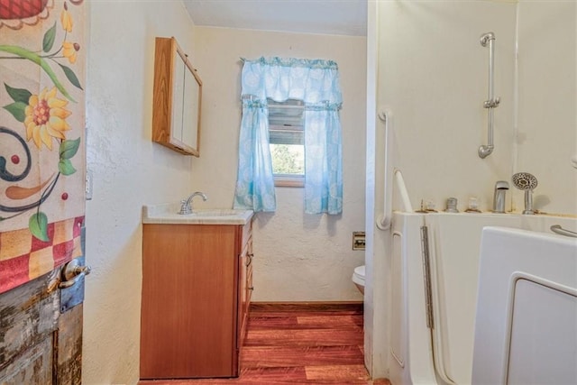 101 7th St, Monongahela City, PA 15063 - bathroom with wood finished floors, vanity, a textured wall, and a shower with shower curtain