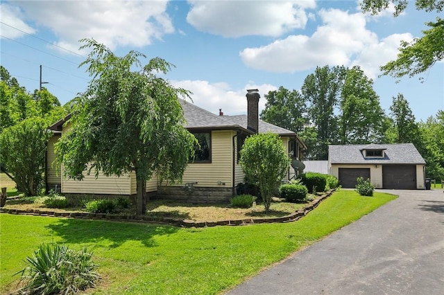 4296 Morefield Rd, Hermitage, PA 16148 - view of front facade featuring a chimney, a garage, a front yard, an outdoor structure, and a shingled roof