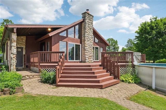 4296 Morefield Rd, Hermitage, PA 16148 - back of house featuring a deck, a chimney, and an outdoor pool