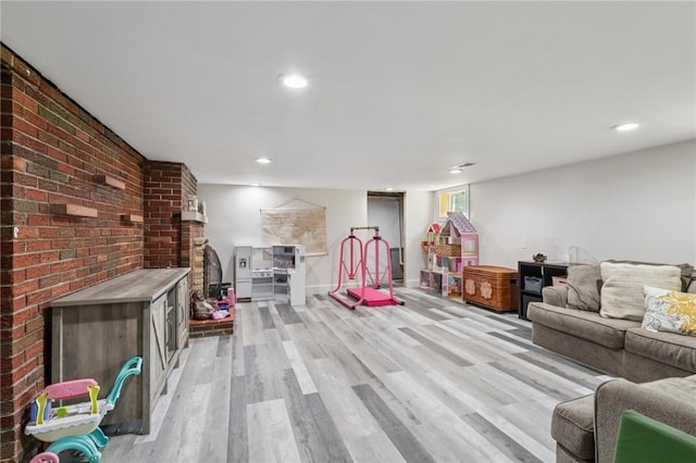 4296 Morefield Rd, Hermitage, PA 16148 - living area with light wood finished floors, brick wall, and recessed lighting