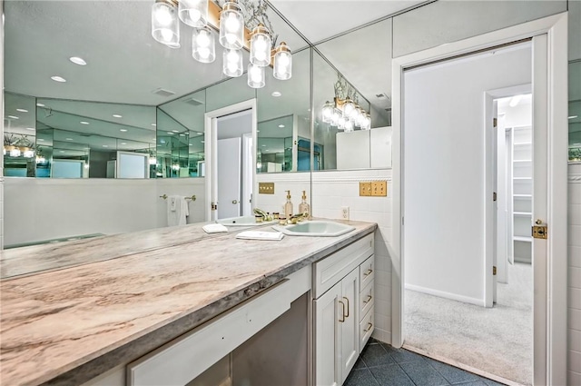 117 Clubhouse Cir, Shenango Twp Mer, PA 16159 - bathroom with tile patterned flooring, vanity, a chandelier, and a walk in closet