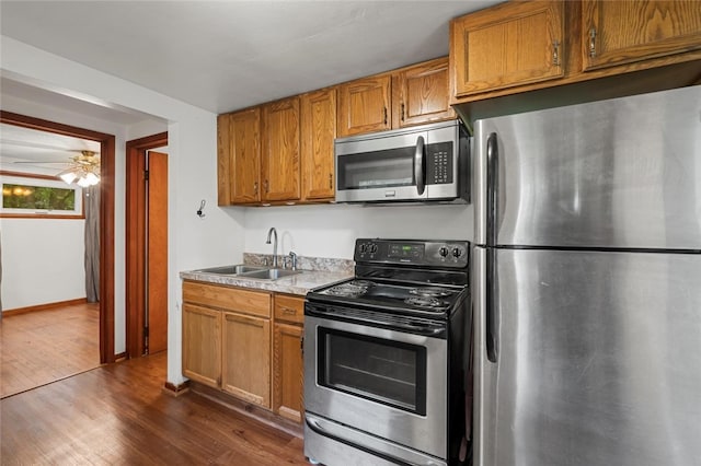 1090-94 N Darby Rd, Hermitage, PA 16148 - kitchen featuring stainless steel appliances, dark wood finished floors, light countertops, and brown cabinets