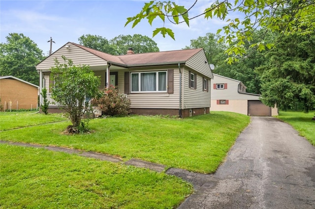 1090-94 N Darby Rd, Hermitage, PA 16148 - view of front of house featuring a front yard, an outbuilding, and a chimney