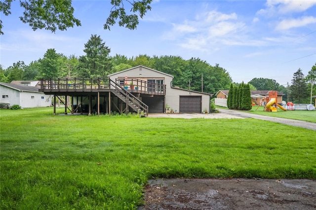 1090-94 N Darby Rd, Hermitage, PA 16148 - view of front facade with driveway, a wooden deck, a garage, a front yard, and stairway