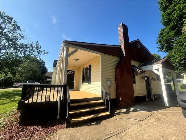 26 Mount View Dr, Burgettstown Boro, PA 15021 - view of front of property with a chimney and covered porch