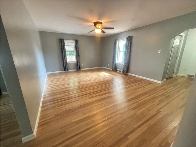 26 Mount View Dr, Burgettstown Boro, PA 15021 - unfurnished room featuring wood finished floors, ceiling fan, and arched walkways