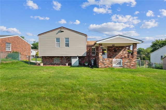 1952 Dearborn Dr, White Oak, PA 15131 - back of property featuring a fenced backyard and brick siding