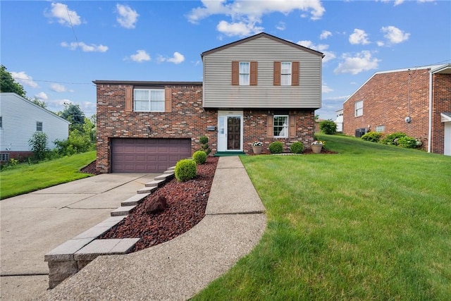 1952 Dearborn Dr, White Oak, PA 15131 - view of front of home with a garage, driveway, a front yard, and brick siding