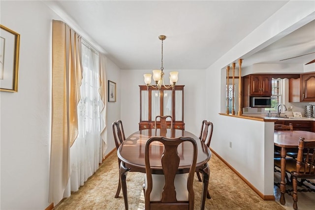 1952 Dearborn Dr, White Oak, PA 15131 - dining room featuring a chandelier and light colored carpet