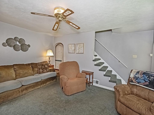 1138 Union Ave, Brackenridge, PA 15014 - carpeted living area with stairs, ceiling fan, and a textured ceiling