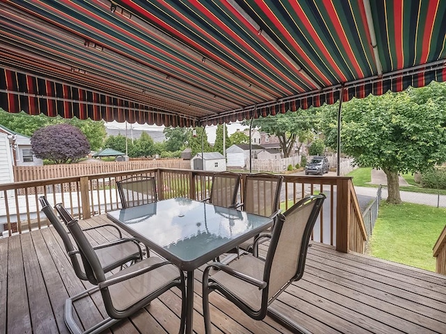 1138 Union Ave, Brackenridge, PA 15014 - deck with outdoor dining space, a storage unit, and a fenced backyard