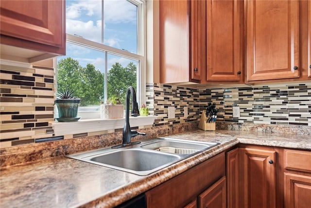 509 Saddle Ridge Dr, Penn Twp Wml, PA 15642 - kitchen featuring tasteful backsplash and brown cabinetry