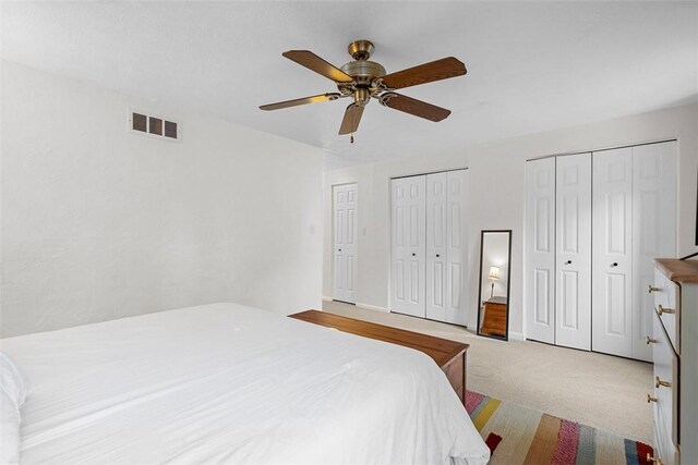 206 Little Hollow Dr, Aleppo, PA 15143 - bedroom with multiple closets, light colored carpet, and a ceiling fan