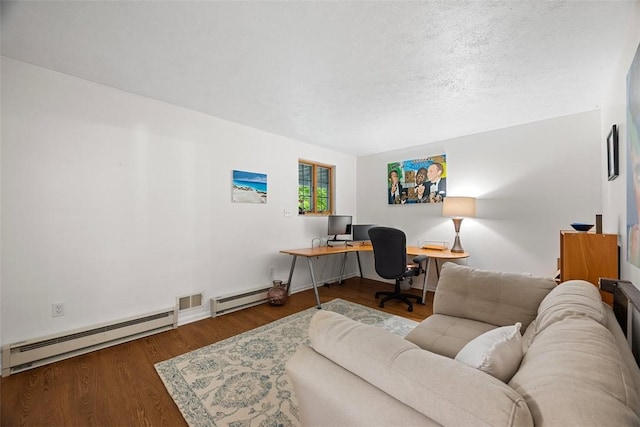 206 Little Hollow Dr, Aleppo, PA 15143 - home office with baseboard heating, a baseboard heating unit, wood finished floors, and a textured ceiling
