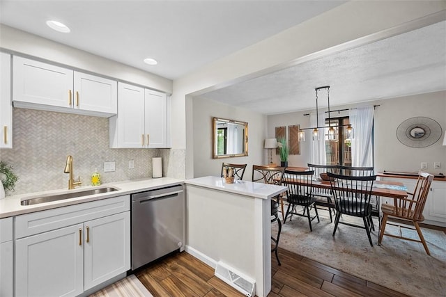 206 Little Hollow Dr, Aleppo, PA 15143 - kitchen with stainless steel dishwasher, a peninsula, white cabinetry, and light countertops