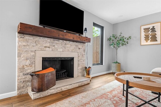 206 Little Hollow Dr, Aleppo, PA 15143 - living room featuring wood finished floors and a fireplace with raised hearth
