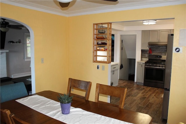533 Charlotte Dr, Baldwin Boro, PA 15236 - dining space featuring ceiling fan, crown molding, dark wood finished floors, arched walkways, and baseboard heating