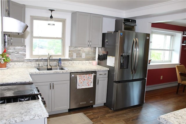 533 Charlotte Dr, Baldwin Boro, PA 15236 - kitchen with appliances with stainless steel finishes, a baseboard radiator, dark wood-style floors, light countertops, and crown molding
