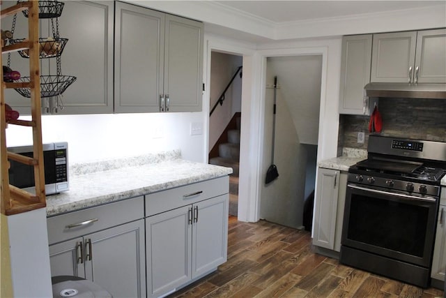 533 Charlotte Dr, Baldwin Boro, PA 15236 - kitchen with stainless steel appliances, under cabinet range hood, gray cabinetry, dark wood-style floors, and light stone counters