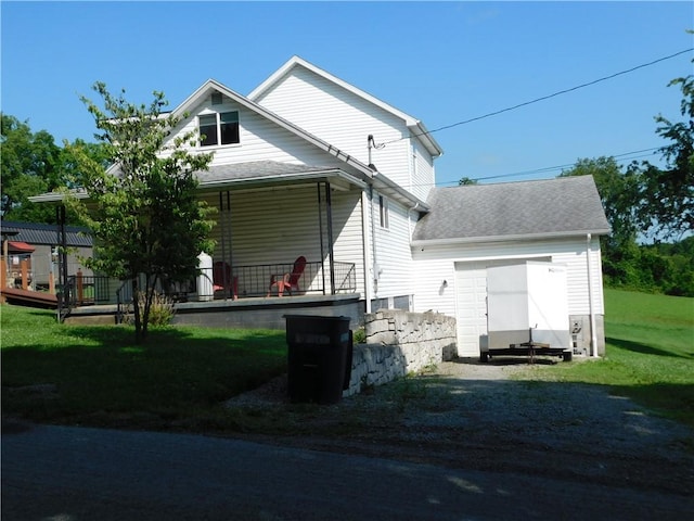 577 Woodside Old Frame Rd, Smithfield, PA 15478 - rear view of house with gravel driveway, a yard, roof with shingles, and a porch